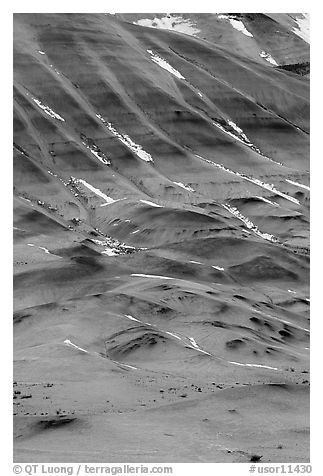 Colorful strata and snow on claystone hills. John Day Fossils Bed National Monument, Oregon, USA