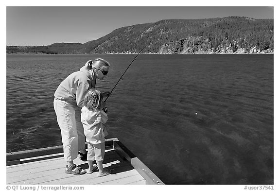 Mother and daughter on deck, East Lake. Newberry Volcanic National Monument, Oregon, USA