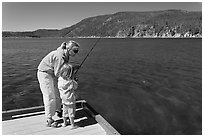 Mother and daughter on deck, East Lake. Newberry Volcanic National Monument, Oregon, USA ( black and white)