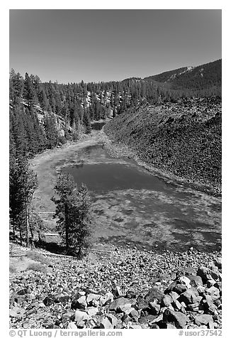 Pond at the edge of big obsidian flow. Newberry Volcanic National Monument, Oregon, USA (black and white)