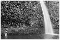 Woman in bikini at the base of Horsetail Falls. Columbia River Gorge, Oregon, USA ( black and white)