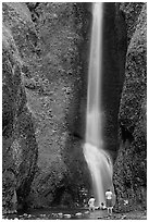 Men soaking at the base of Oneonta Falls. Columbia River Gorge, Oregon, USA (black and white)