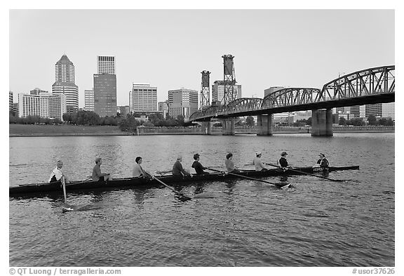 Eight-oar shell on Williamette River and city skyline. Portland, Oregon, USA (black and white)