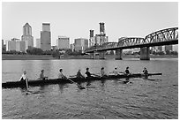 Eight-oar shell on Williamette River and city skyline. Portland, Oregon, USA (black and white)