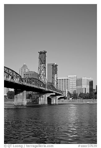 Williamette River at Hawthorne Bridge and high-rise buildings. Portland, Oregon, USA (black and white)