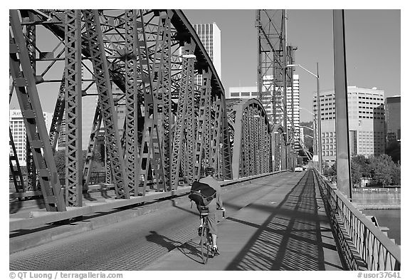 Bicyclist on Hawthorne Bridge. Portland, Oregon, USA (black and white)