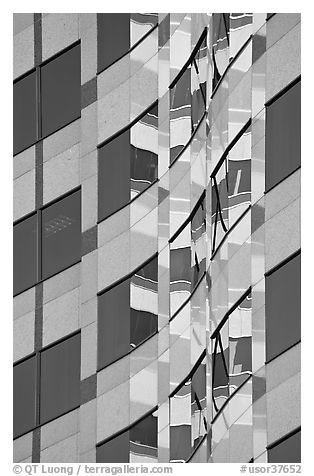 Pattern of windows and reflections in high rise building. Portland, Oregon, USA (black and white)