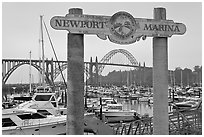 Newport marina and sign, foggy sunrise. Newport, Oregon, USA (black and white)