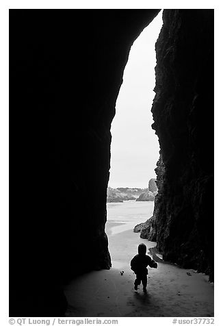 Infant and sea cave opening from inside. Bandon, Oregon, USA (black and white)