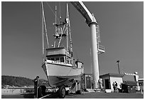 Fishing boat lifted onto deck, Port Orford. Oregon, USA (black and white)