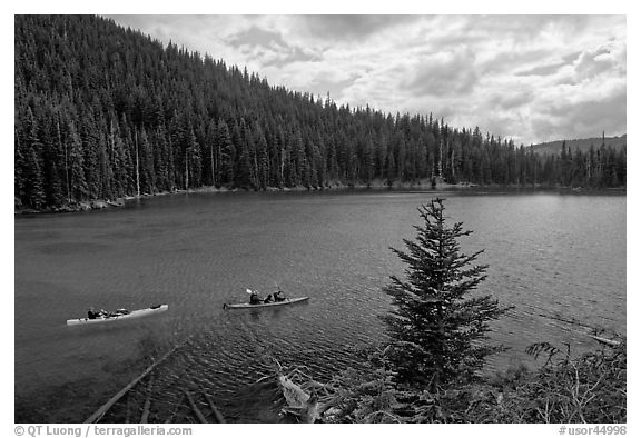 Kayaks on emerald waters, Devils Lake, Deschutes National Forest. Oregon, USA (black and white)