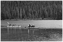 Parents kayaking with children in tow, Devils Lake. Oregon, USA (black and white)