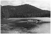 Family kayaking on Devils Lake. Oregon, USA ( black and white)