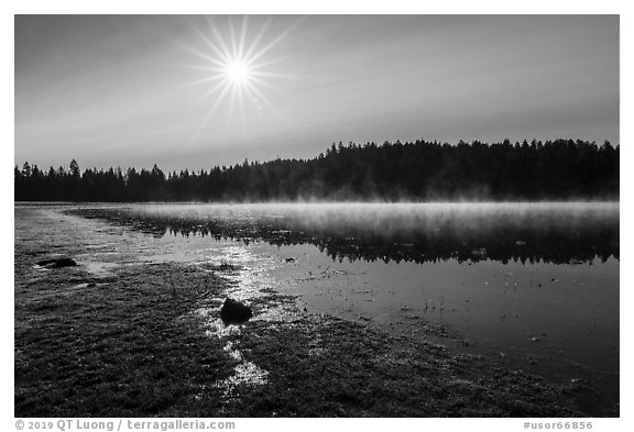 Sun and fog rising of Hyatt Lake. Cascade Siskiyou National Monument, Oregon, USA (black and white)