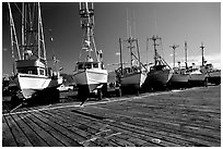 Boats on the dry deck of Port Orford. Oregon, USA ( black and white)