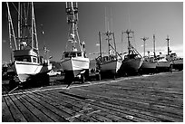 Boats on the dry deck of Port Orford. Oregon, USA (black and white)