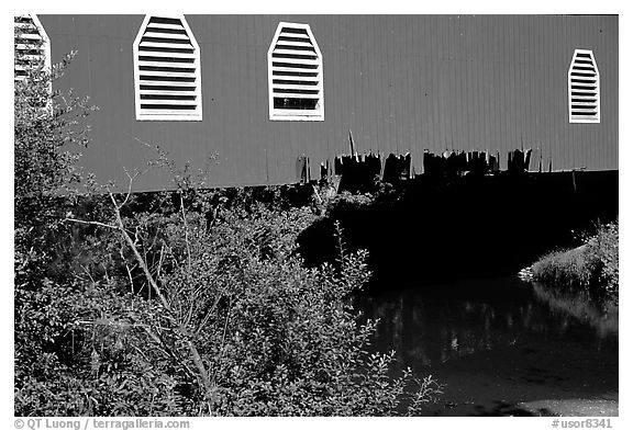 Detail of red covered bridge and river, Willamette Valley. Oregon, USA