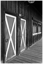 Painted doors and wood building, Winthrop. Washington (black and white)