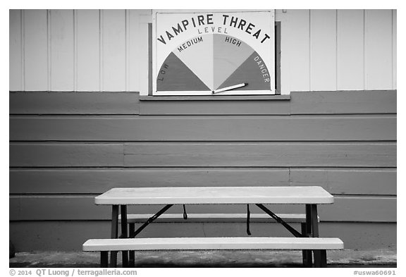 Bench and vampire threat sign near Forks. Olympic Peninsula, Washington (black and white)