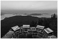 Interpretive signs on top of Ellsworth Storey Tower at sunset, Moran State Park. Washington ( black and white)