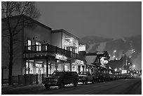 Storehouses and night-lit Snow King ski area. Jackson, Wyoming, USA (black and white)