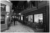 Alley with art galleries, winter night. Jackson, Wyoming, USA (black and white)
