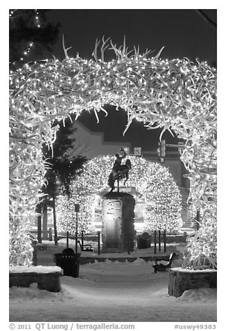 Statue and antler arches by night. Jackson, Wyoming, USA