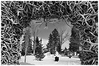 Town Square framed by Antler Arch in winter. Jackson, Wyoming, USA (black and white)
