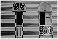 Red window shutters and striped walls, Parc De Bombas, Ponce. Puerto Rico (black and white)