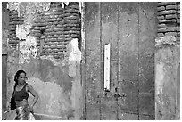 Woman in front of a decaying brick wall, Ponce. Puerto Rico ( black and white)