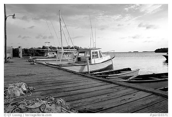 Pier and small boats at sunset, La Parguera. Puerto Rico (black and white)