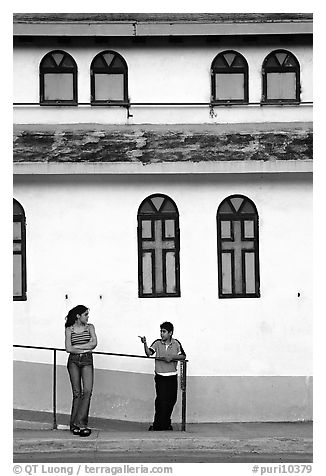 Woman and boy talking besides a church, La Parguera. Puerto Rico (black and white)