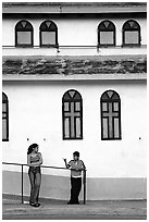 Woman and boy talking besides a church, La Parguera. Puerto Rico (black and white)