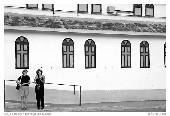 Two women standing in front of a church, La Parguera. Puerto Rico (black and white)