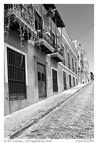 Old cobblestone street and pastel-colored houses, old town. San Juan, Puerto Rico (black and white)