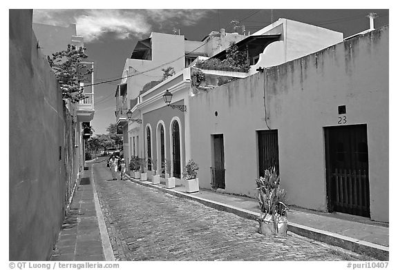 Cobblestone street and colorful houses, old town. San Juan, Puerto Rico (black and white)