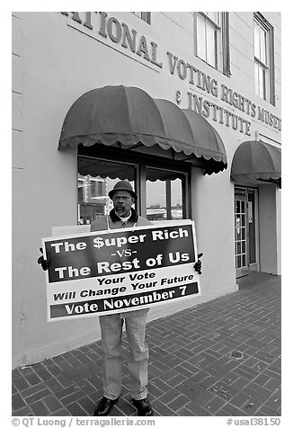 African-American man holding a voting sign in front of the voting rights museum. Selma, Alabama, USA