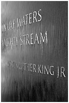 Words from bibical quote and Martin Luther King name, Civil Rights Memorial. Montgomery, Alabama, USA (black and white)