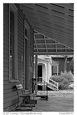 Porch, bench, and buildings in Old Alabama Town. Montgomery, Alabama, USA (black and white)