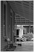 Porch, bench, and buildings in Old Alabama Town. Montgomery, Alabama, USA ( black and white)
