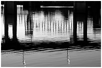 Bridges reflected in the Arkansas River at sunrise. Little Rock, Arkansas, USA (black and white)