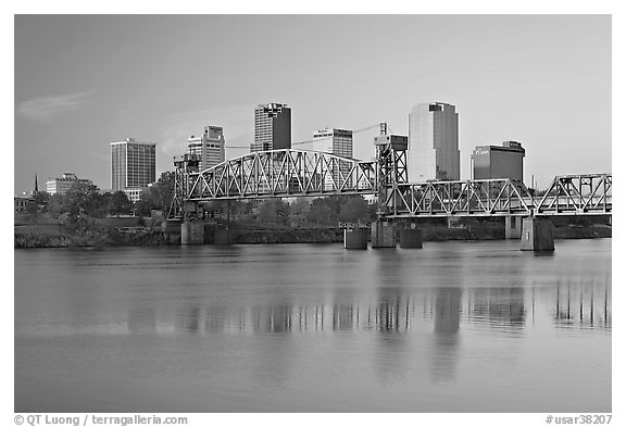 Skyline and bridge with reflections in river at sunrise. Little Rock, Arkansas, USA