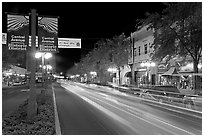 Historic district avenue with car lights. Hot Springs, Arkansas, USA (black and white)