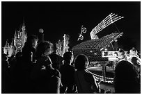 Families watching night parade, Magic Kingdom. Orlando, Florida, USA (black and white)