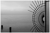 Grid and pilings and sunrise. Key West, Florida, USA ( black and white)