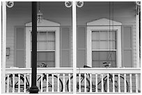 Bicycle on pastel-colored porch. Key West, Florida, USA (black and white)