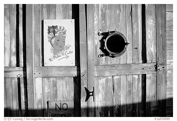 Wooden door with cuba poster. Key West, Florida, USA