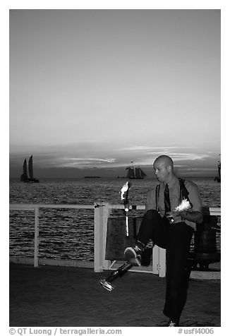 Juggler on Mallory Square, sunset. Key West, Florida, USA (black and white)