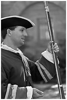 Man dressed as a Spanish soldier in the 18th century demonstrates gun, Fort Matanzas National Monument. St Augustine, Florida, USA ( black and white)