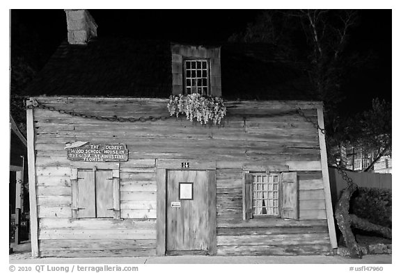 Facade of oldest wooden school house in the US by night. St Augustine, Florida, USA (black and white)